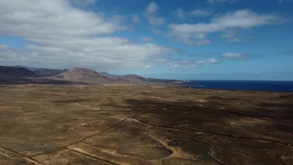 Aerial view of mountains and volcanic plains in Lanzarote, Canary Islands