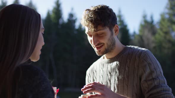 Couple drinking from mugs