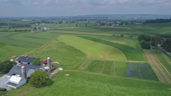 Aerial View of Amish Countryside With Farmlands and Crops