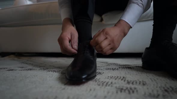 Closeup View of Young Male Hands Getting Dressed at Morning Wedding