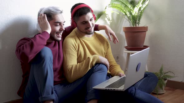 Gay Male Couple Doing Video Call on Laptop Computer at Home  LGBT Lifestyle