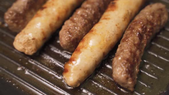 Tasty Juicy Sausages Grilling Over a Fire