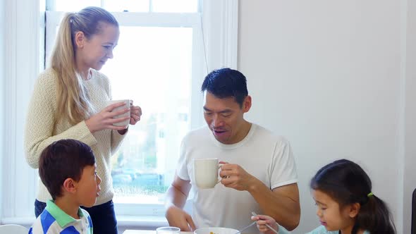 Happy family having breakfast