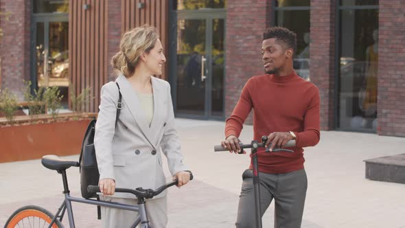 Portrait of Active Business Partners with Vehicles Outdoors