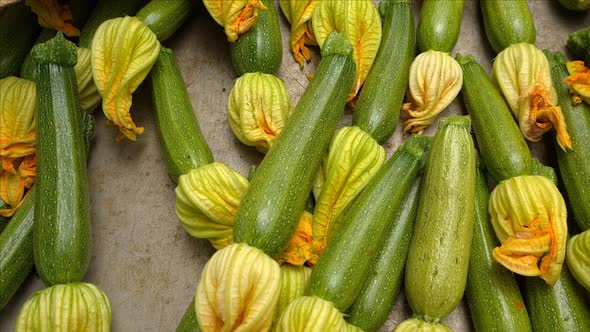 Close-up of zucchini with flowers selling on market