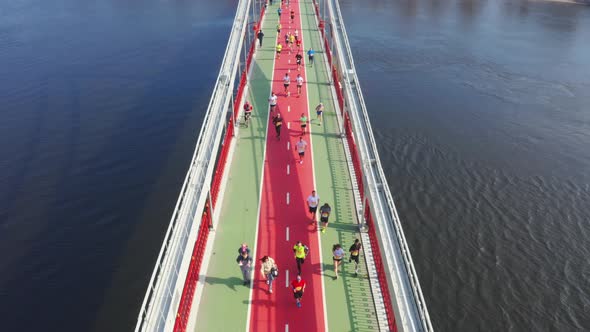 Runners on the Bridge During the Marathon