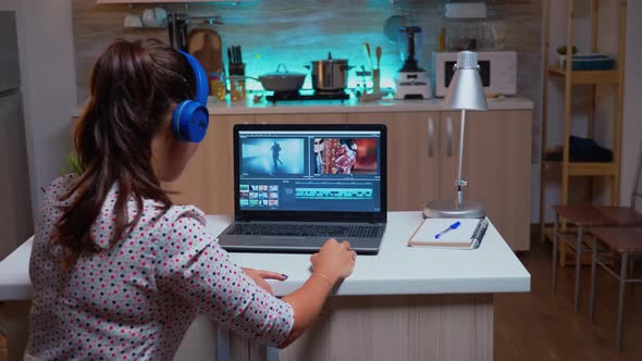 Filmmaker Editing Video Footage During Night Time