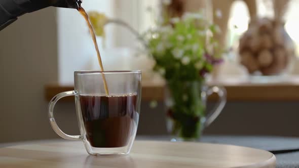 Aromatic Black Coffee is Poured Into Clear Glass Cup Geyser Coffee Maker Slow Motion