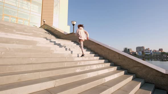 Female Jogger Going Up Stairs