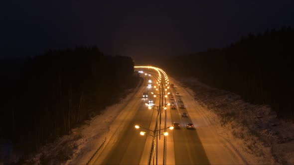 Aerial View of The Traffic on The Road in The Winter Night