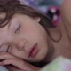 Little girl sleeping in morning light - VideoHive Item for Sale