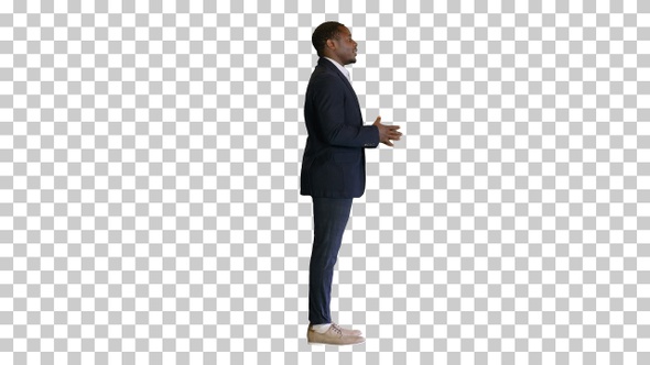 Young black businessman speaking to the camera, Alpha Channel