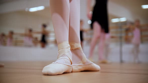 Ballet Training  Little Girl Training Her Stands on Pointe Shoes