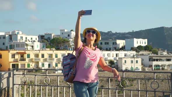 Woman Taking Photos with Smart Phone in Vacation