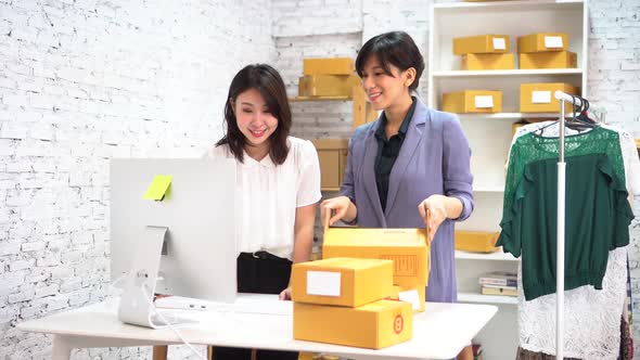 Happy Asian Business Women Smiling in the Office