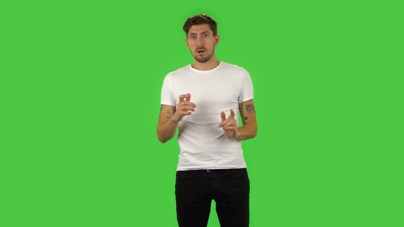 Confident Guy Is Frightened Then Sighs with Relief and Smiles. Green Screen