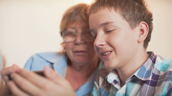 Young Boy and Old Person Learn Smartphone alt