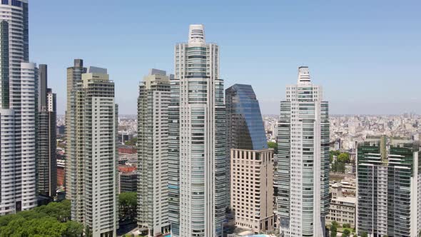 Aerial shot orbiting around high-rise buildings in Puerto Madero waterfront, Buenos Aires