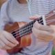 Beautiful Asian teenage girl playing at ukulele in the park, Slow motion - VideoHive Item for Sale