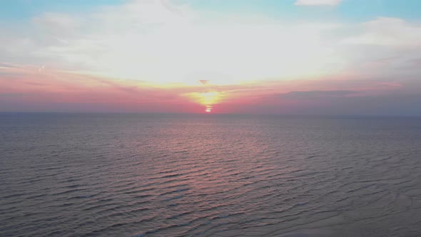 Sunset over rippling sea