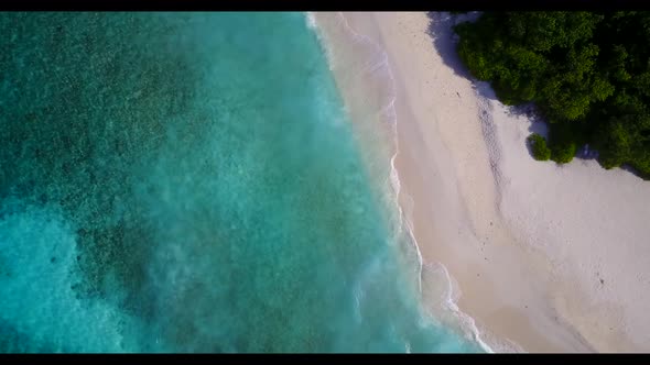 Aerial flying over scenery of tropical bay beach trip by blue water with white sand background of a 