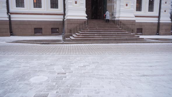 Woman climbing stairs to Alexander Nevsky Cathedral in Tallinn, Estonia.