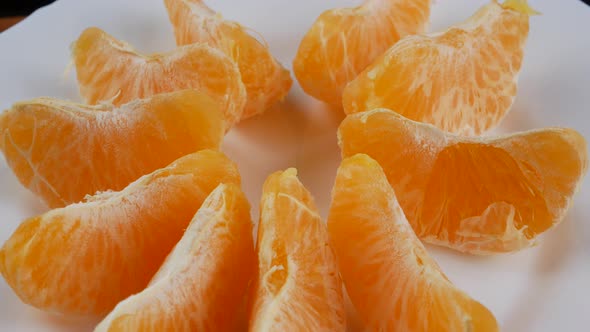 Tangerines or mandarin orange fruits and peeled segment.