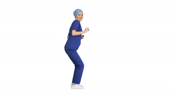 Pretty Dancing Doctor in Blue Uniform on White Background.