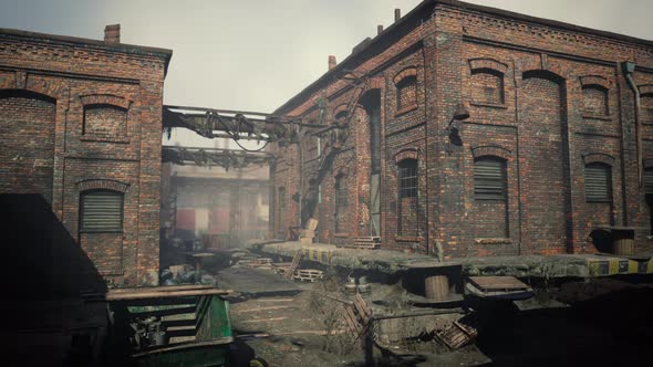 Abandoned Industrial Factory Buildings at Sunset alt