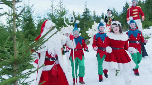 Santa Claus and his helpers dancing