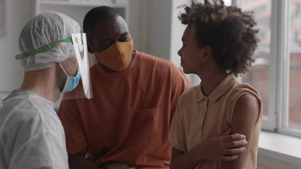 Boy High-fiving Medical Worker