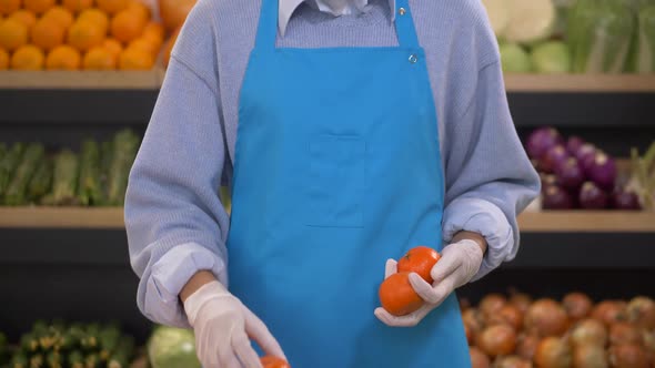 Masked Female Supermarket Employee During Work