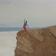 A Young Woman Is on the Slackline at High Altitude - VideoHive Item for Sale