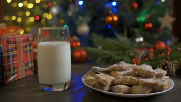 Putting Gingerbread Cookies on Wood Table