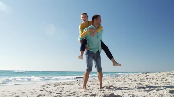 Couple in love enjoying free time on the beach together