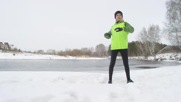 Active Woman Exercising Outdoors in Winter