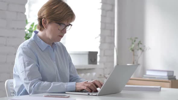 Loss Frustrated Old Woman Working on Laptop