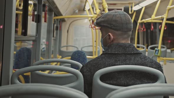 A young man rides an empty bus. Protecting health in an Epidemic.