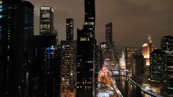 Urban Skyline of Chicago and Chicago River at Night in Winter
