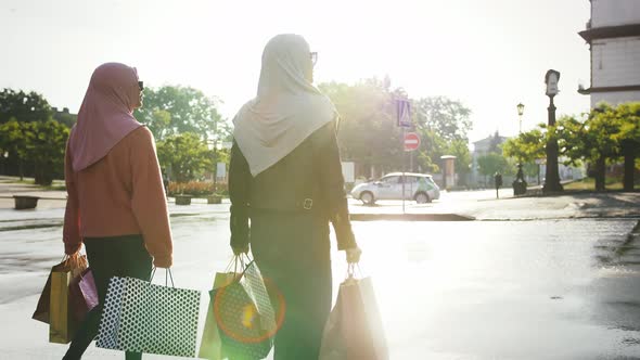Two Muslim Girls in Casual Clothes Sunglasses and Colorful Hijabs