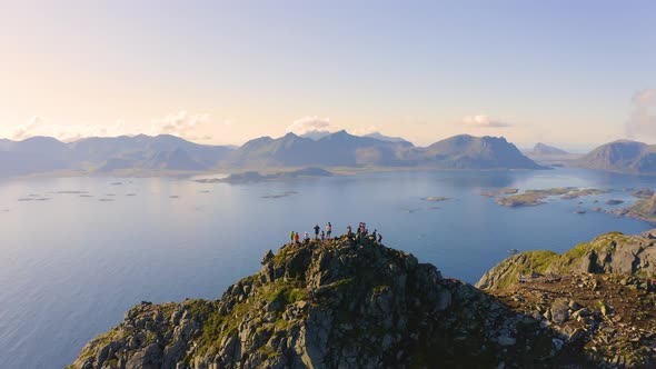 Flying Around Mount Festvagtinden with Tourists at the Top in Lofoten Norway