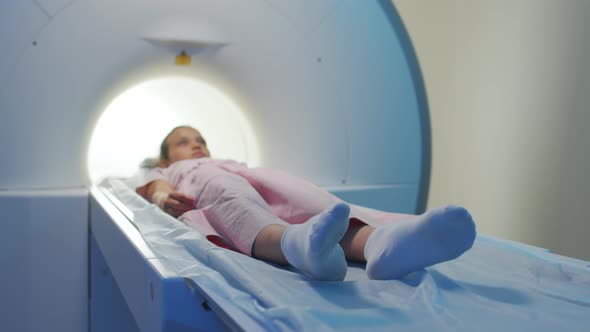 Little Girl on Magnetic Resonance Imaging Scanner