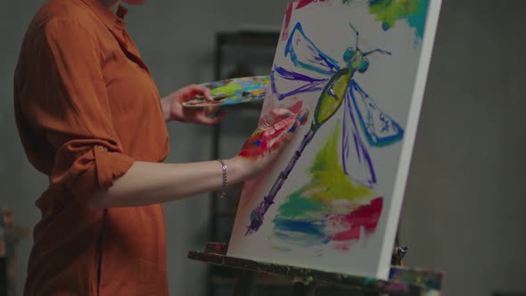 Woman Artist Fingerpainting Artwork in Studio