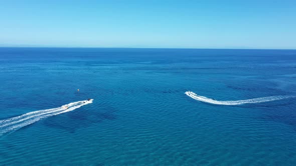 Aerial View of a Motor Boat Towing a Tube. Zakynthos, Greece