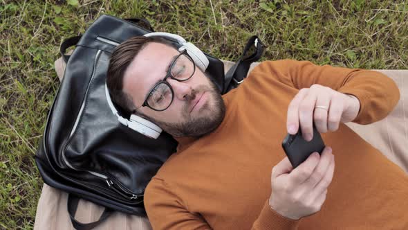 Man Lying on Ground Relaxing