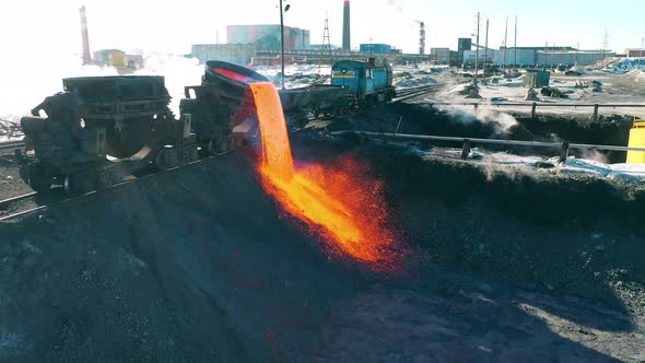 Molten Metal is Pouring From Wagon Tanks Onto the Ground