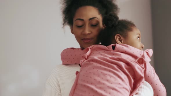 Lovely mother hugging daughter