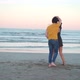 Couple dancing on shore near sea - VideoHive Item for Sale