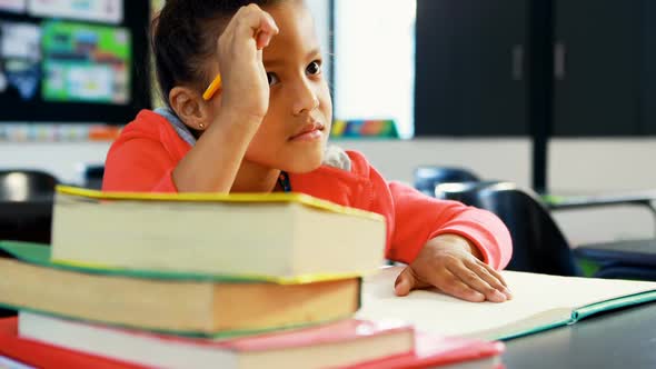 Girl doing homework in classroom 4k