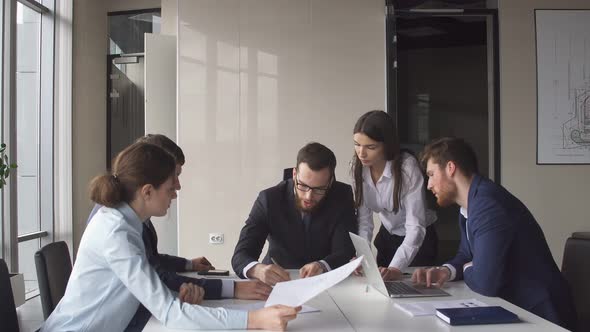 Portrait of Young Business Team at Work. Bright Contemporary Small Creative Business.